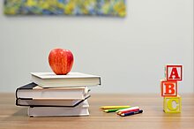 Red Apple Fruit on four pile Books Element5 Digital/unsplash.com (https://unsplash.com/photos/OyCl7Y4y0Bk)