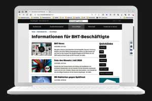 Laptop, auf dessen Bildschirm die Webseite "Informationen für Beschägtigte" geöffnet ist
